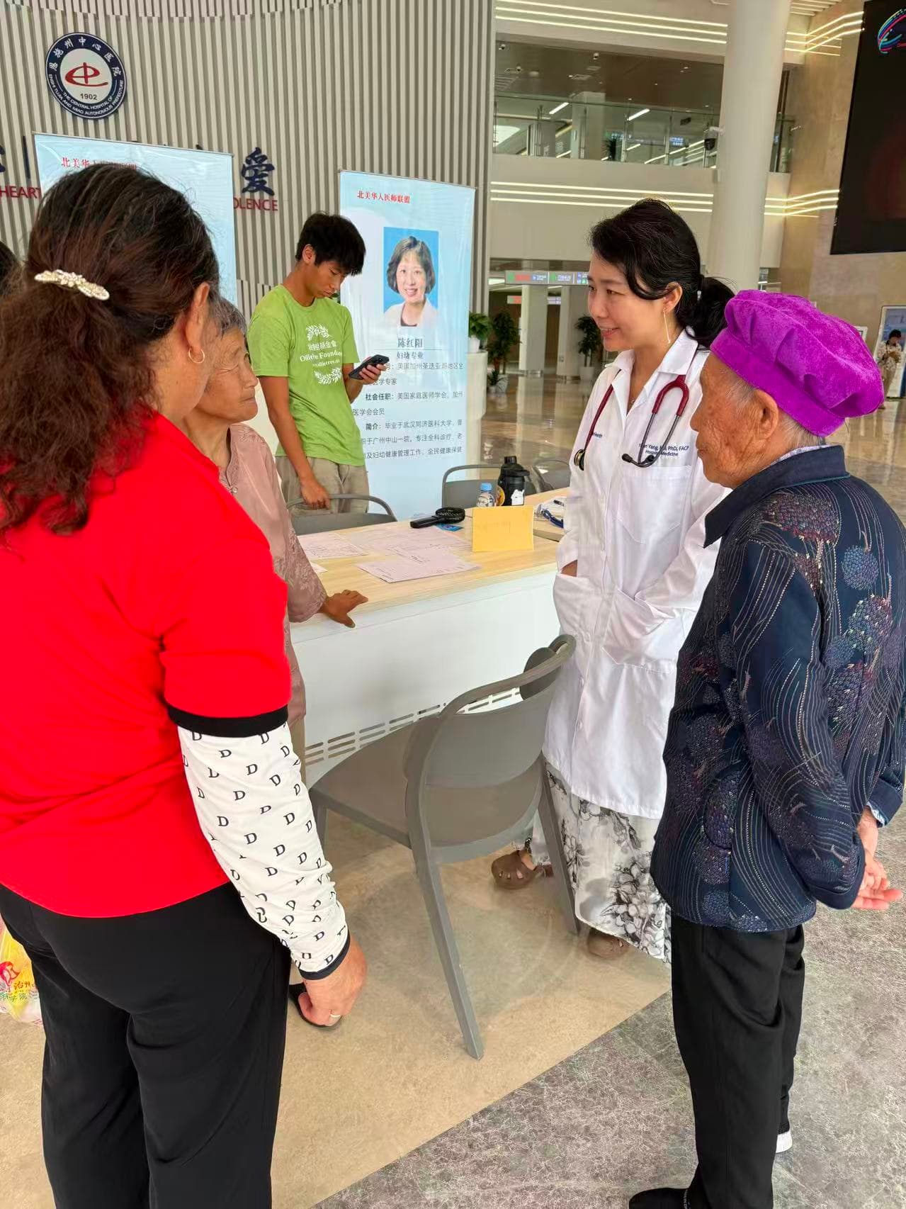 A CCHPA physician speaking with community members during a health outreach program